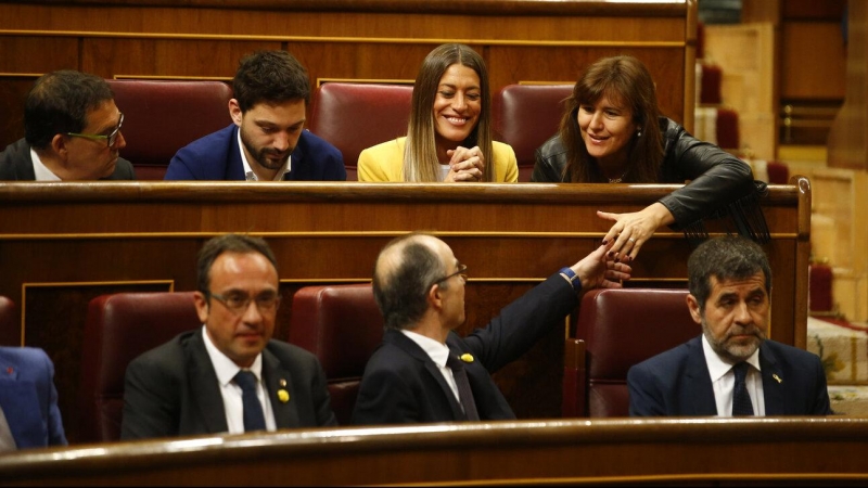 Els exdiputats de JxCat Jordi Sànchez, Jordi Turull i Josep Rull, asseguts als escons del Congrés dels Diputats durant la sessió constitutiva del 21 de maig del 2019.