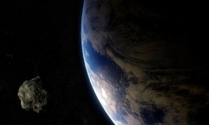 Ilustración de un asteroide y la Tierra.