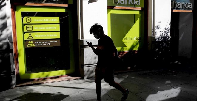 La fusión de CaixaBank y Bankia: una operación con más sombras que luces