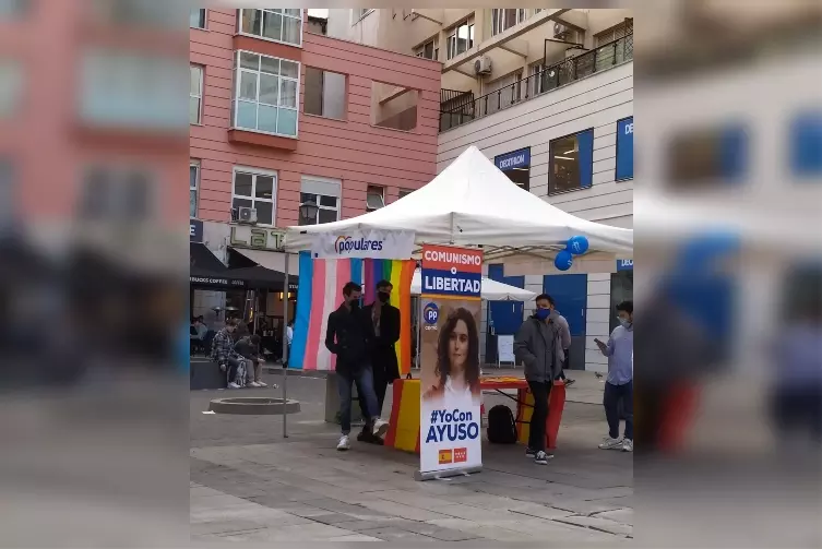 tweeters do not give credit to the flags hanging from an electoral campaign post of the Popular Party in Madrid